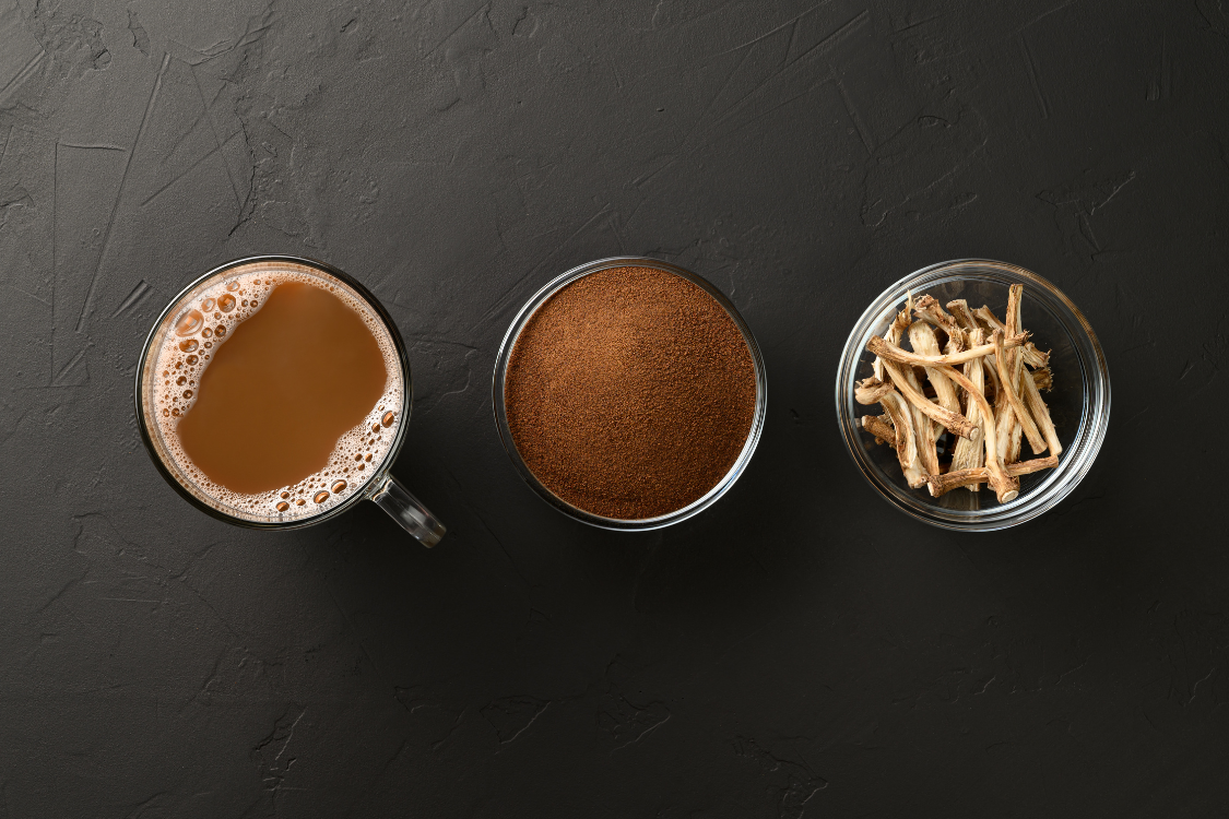 Dandelion root coffee in a glass mug with ground powder and dried roots – herbal coffee substitute for digestion