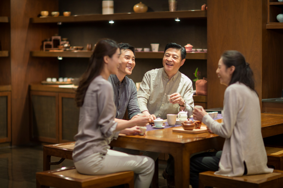 Asian family drinking green tea.