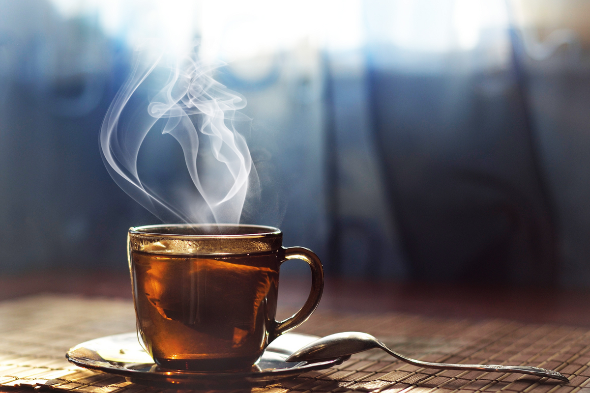 A steaming cup of green tea.
