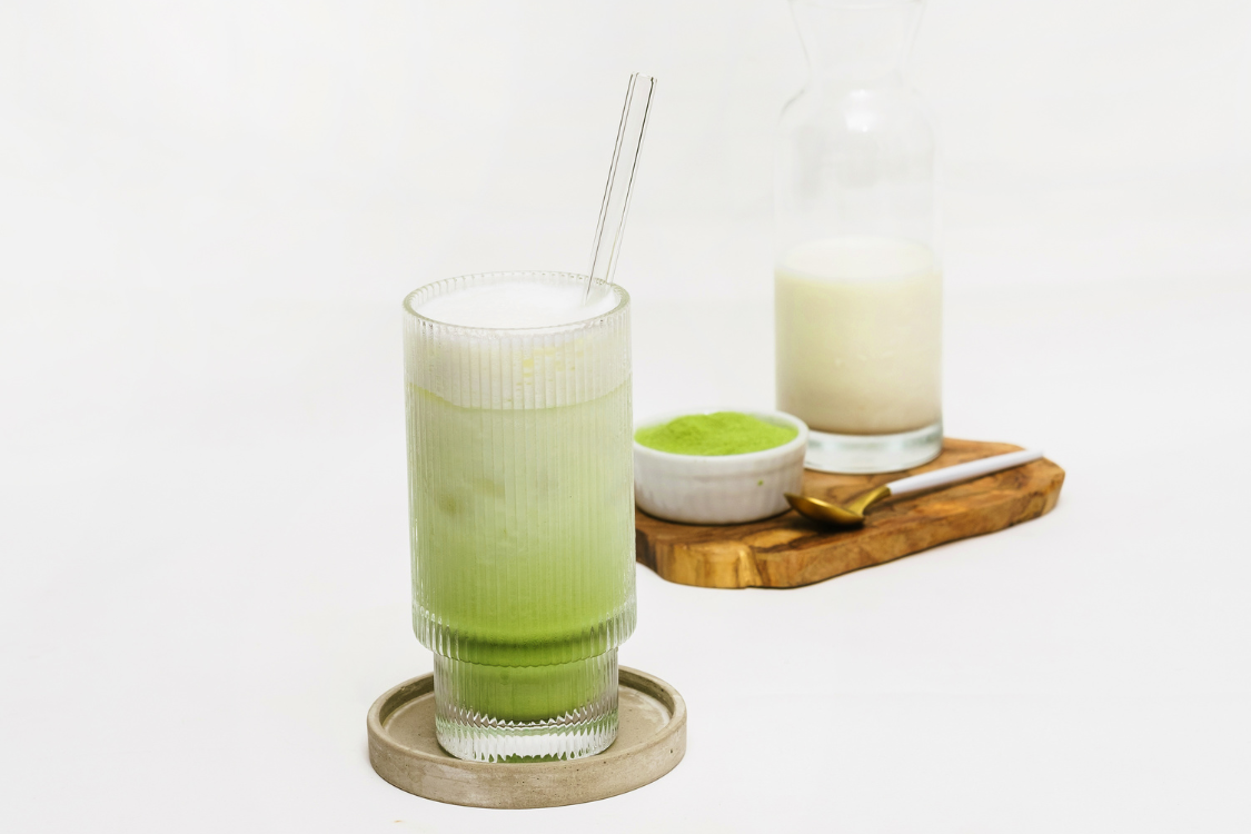 Iced matcha latte with creamy foam made using plant-based milk