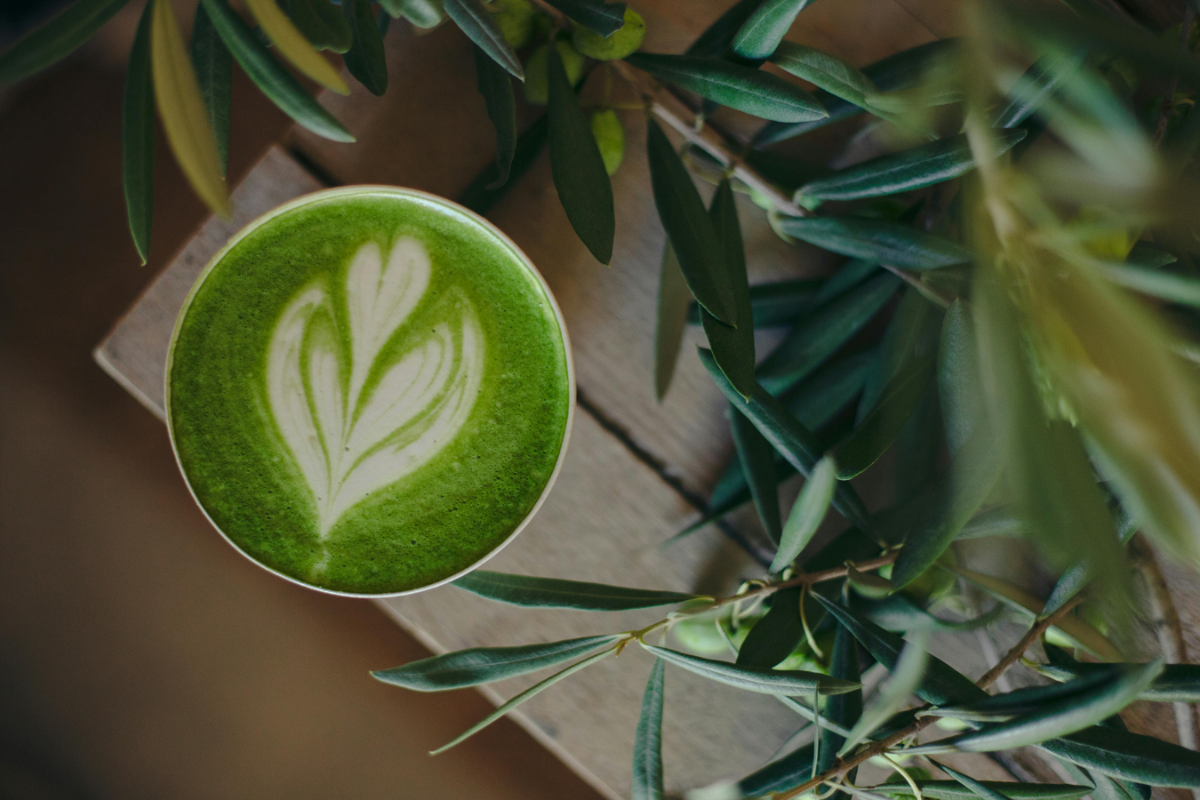 Cup of matcha latte with art.