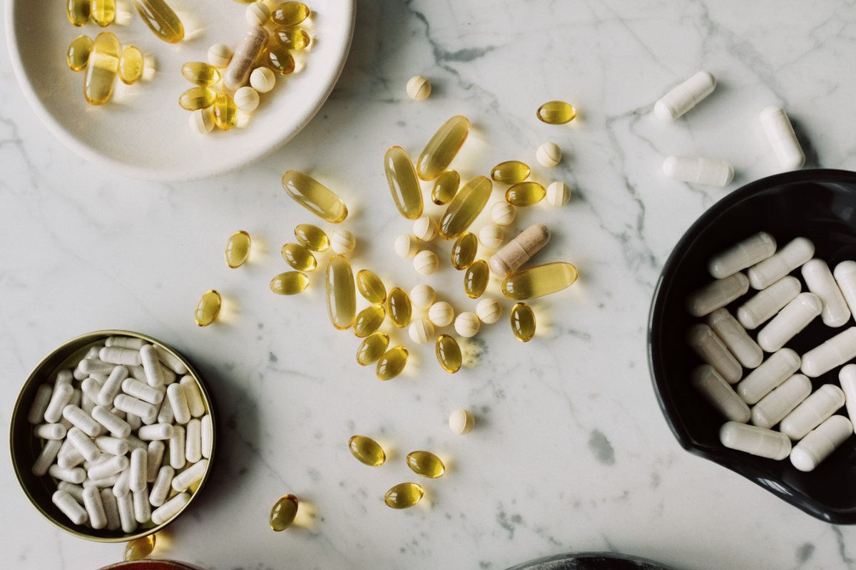Supplements spread on a white surface.