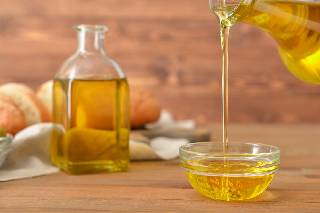 Extra virgin olive oil being poured into a bowl, commonly produced in leading olive oil producer countries