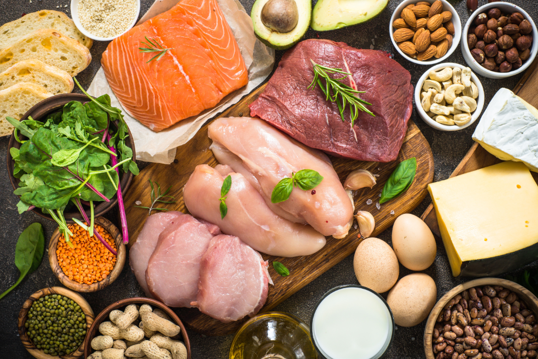 Image of various high-protein foods like chicken, eggs, and nuts.