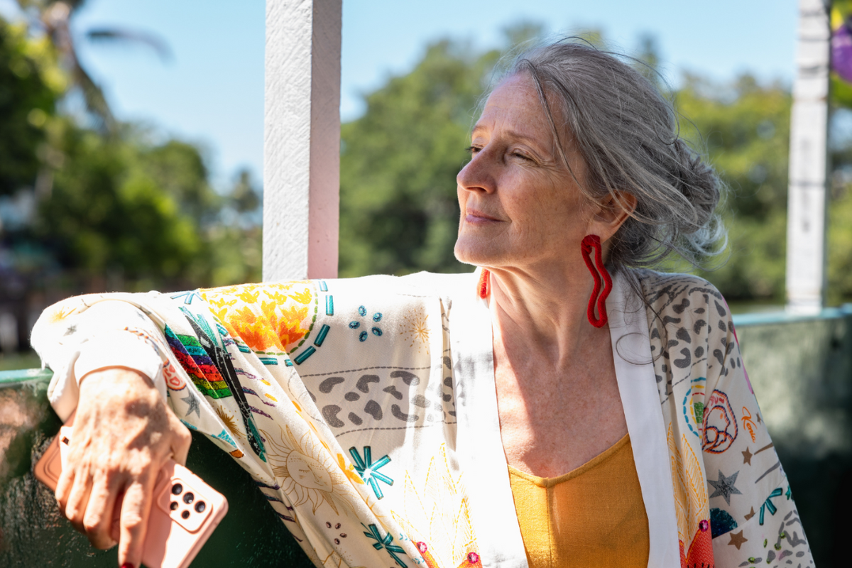 Middle-aged woman looking content.