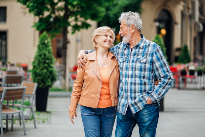 Older couple walking.