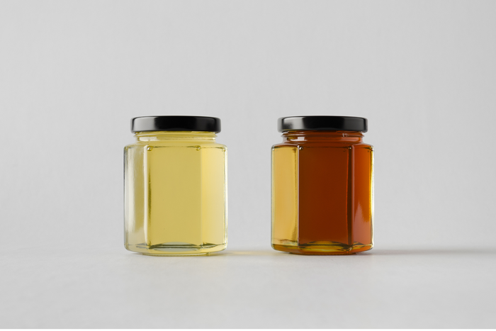 Two different jars of honey.