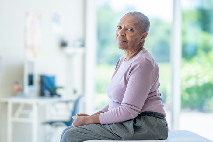 Cancer patient sitting in a chair.