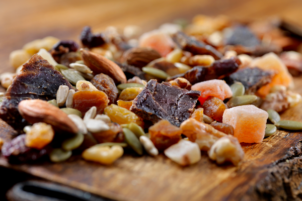 Protein snack with beef jerky, nuts, and seeds.