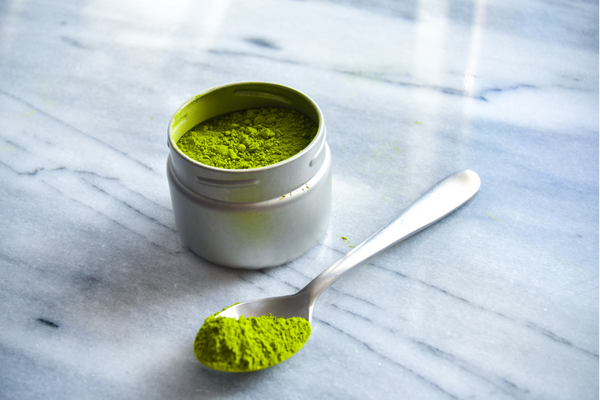 Matcha powder in a container.