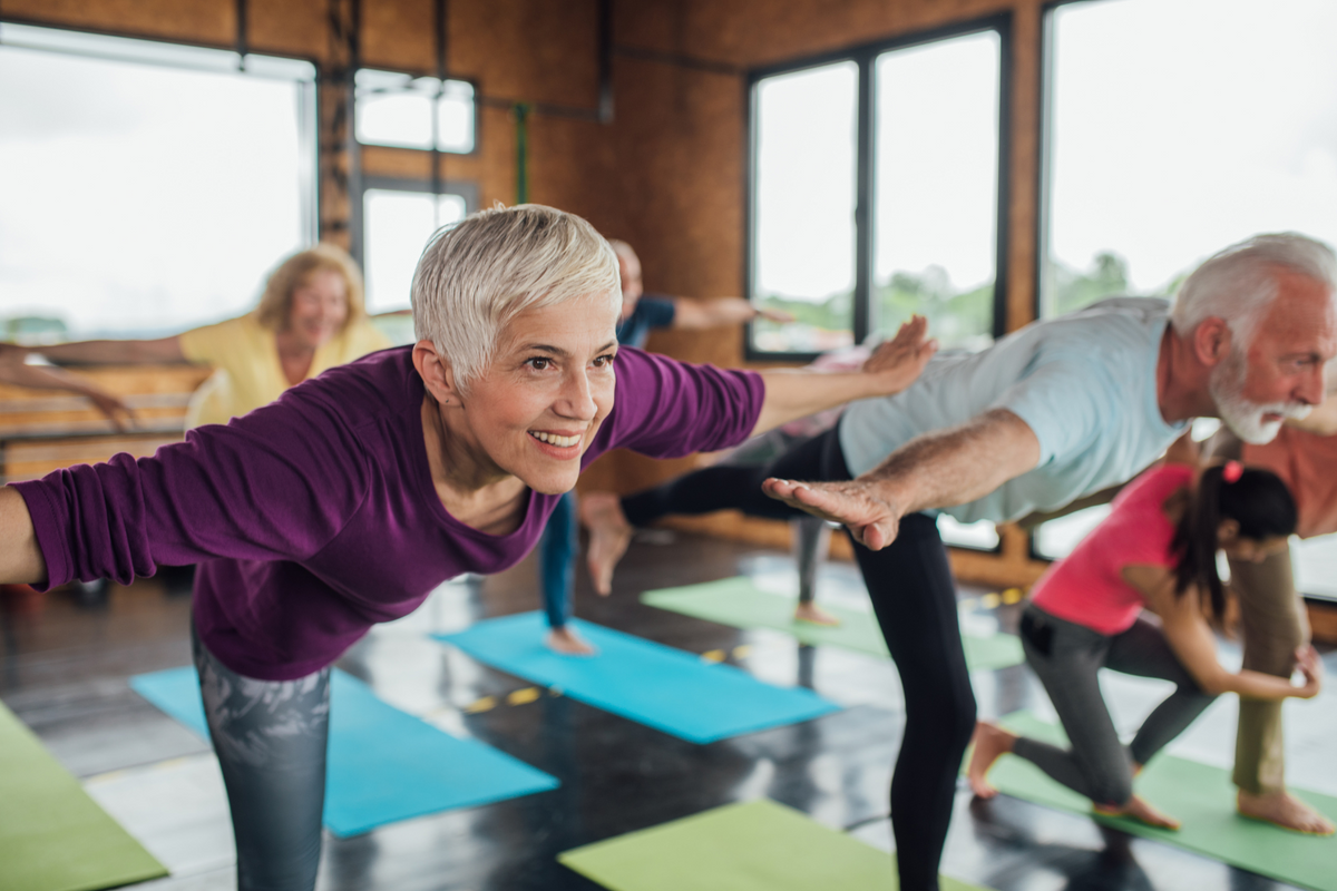Older adult woman doing yoga.