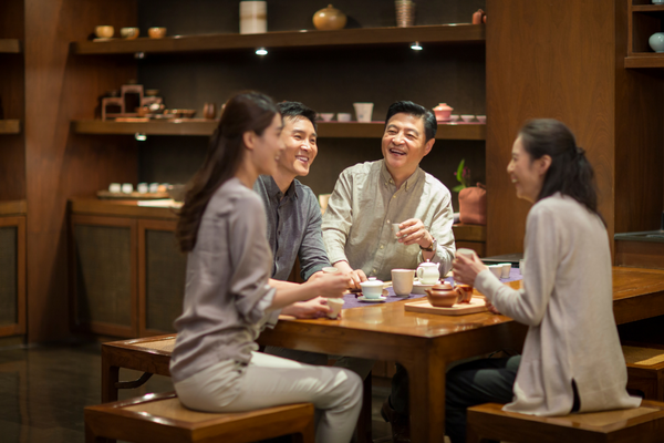 Asian family drinking green tea.