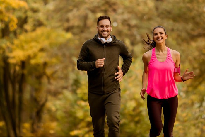 Couple jogging at a park.