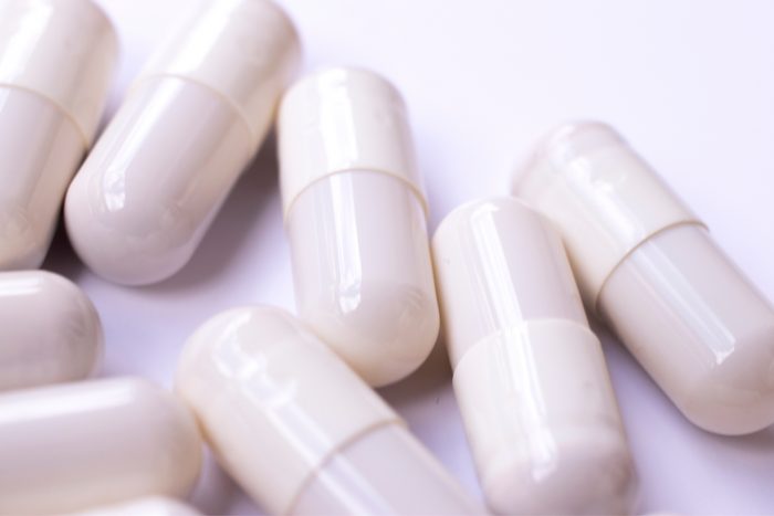 White supplements in white surface.