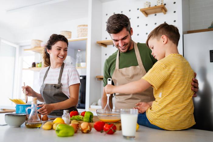 Family helping together in the kitchen.