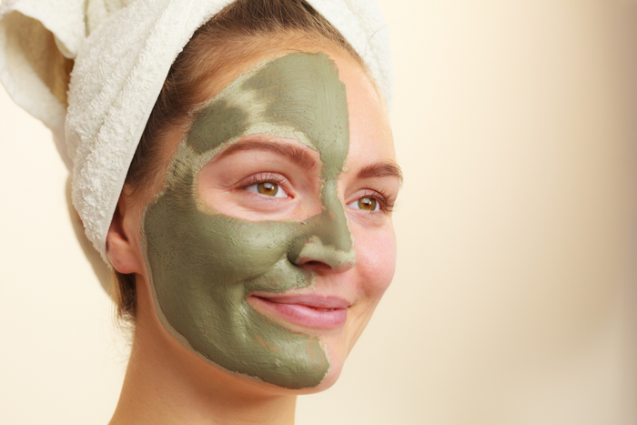 Woman with matcha face mask.