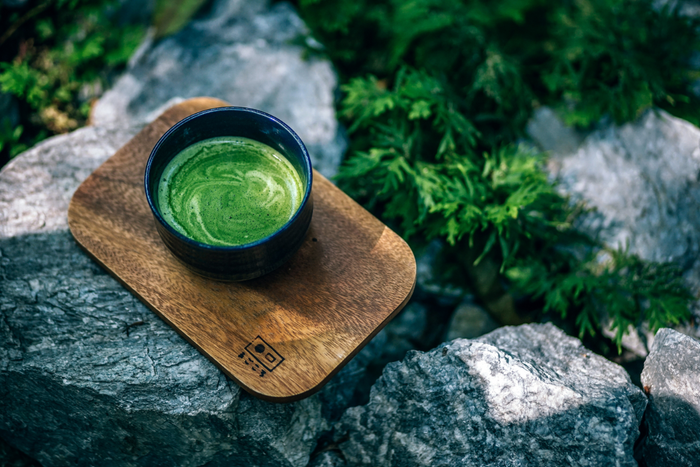 Cup of matcha on a Japanese tray.