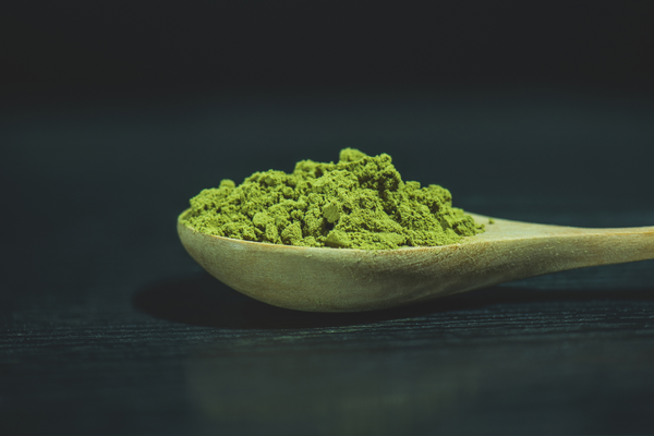 Spoon with matcha powder.