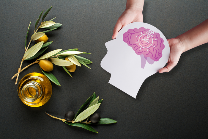 Illustration of brain health with olive oil and olives on a dark background