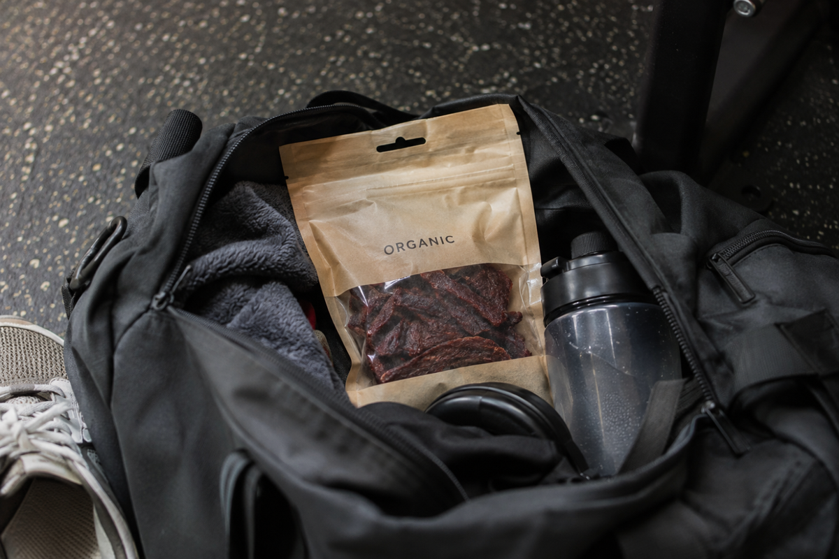 Pack of organic beef jerky in a gym bag.