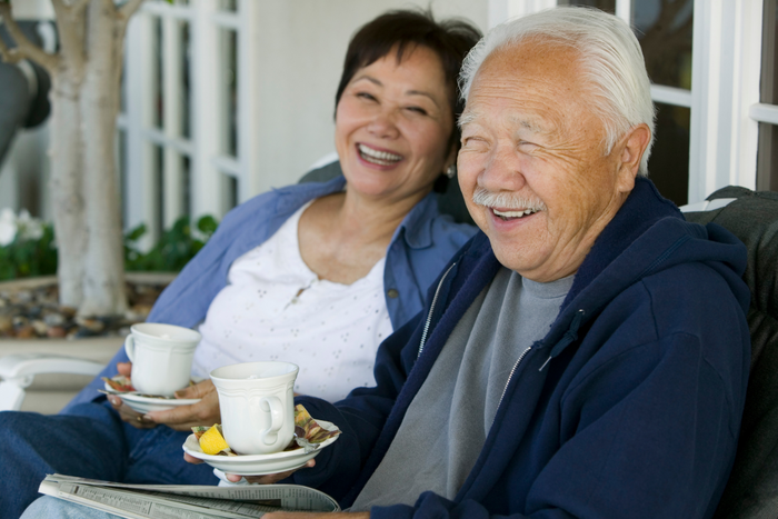 Older couple drinking tea.