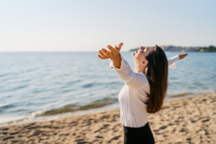 Woman looking relieved and happy.