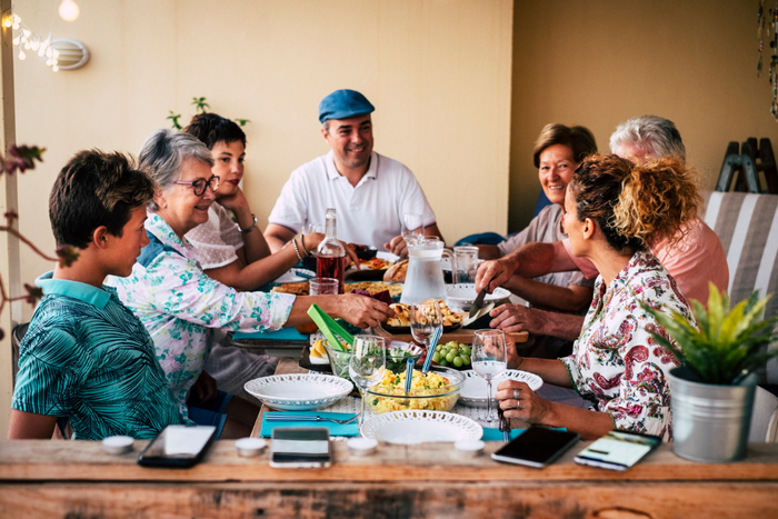 Family gathering and eating together.