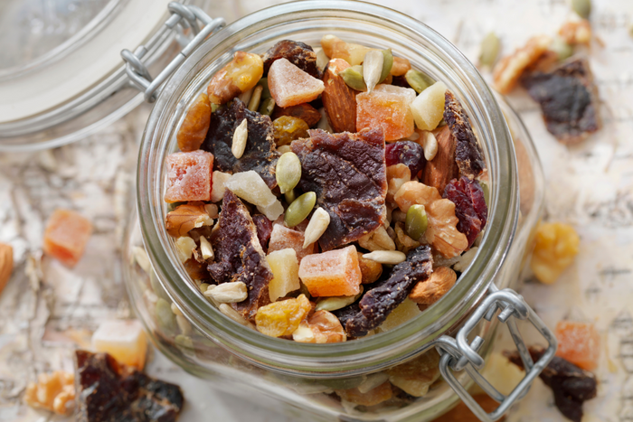 Airtight container with beef jerky trail mix inside.